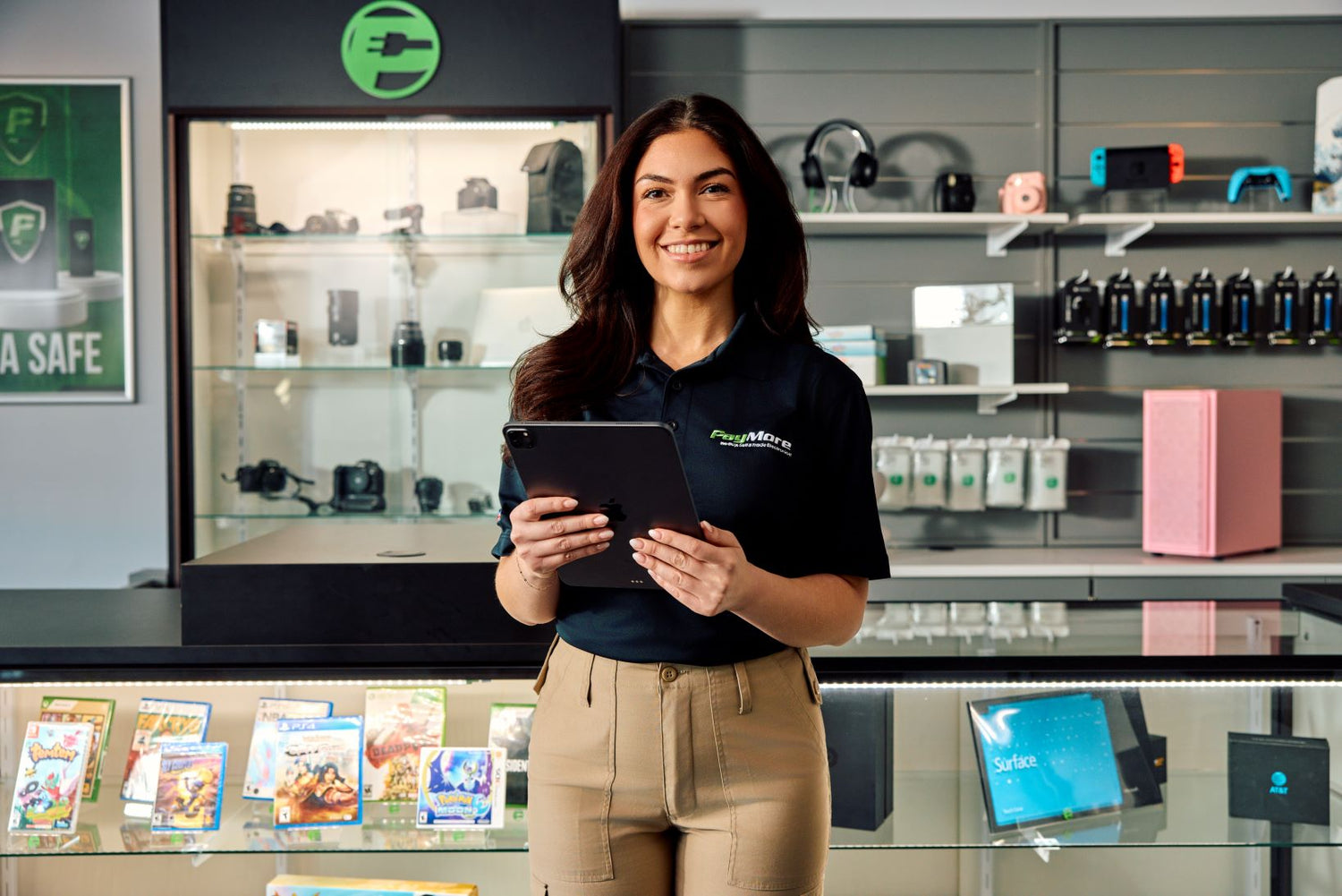 paymore employee holding a tablet and smiling
